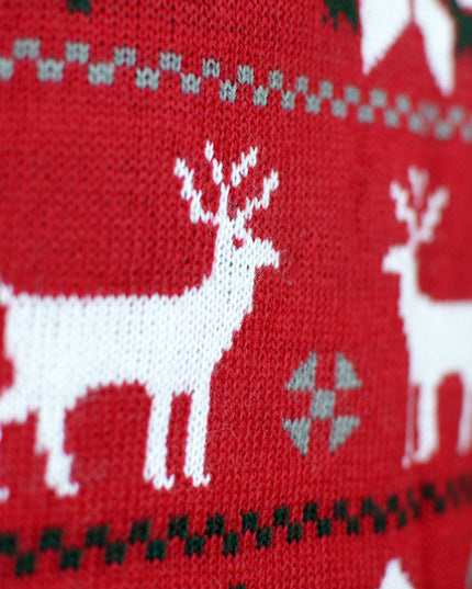 Børns julesweater med rensdyr, træer og stjerner